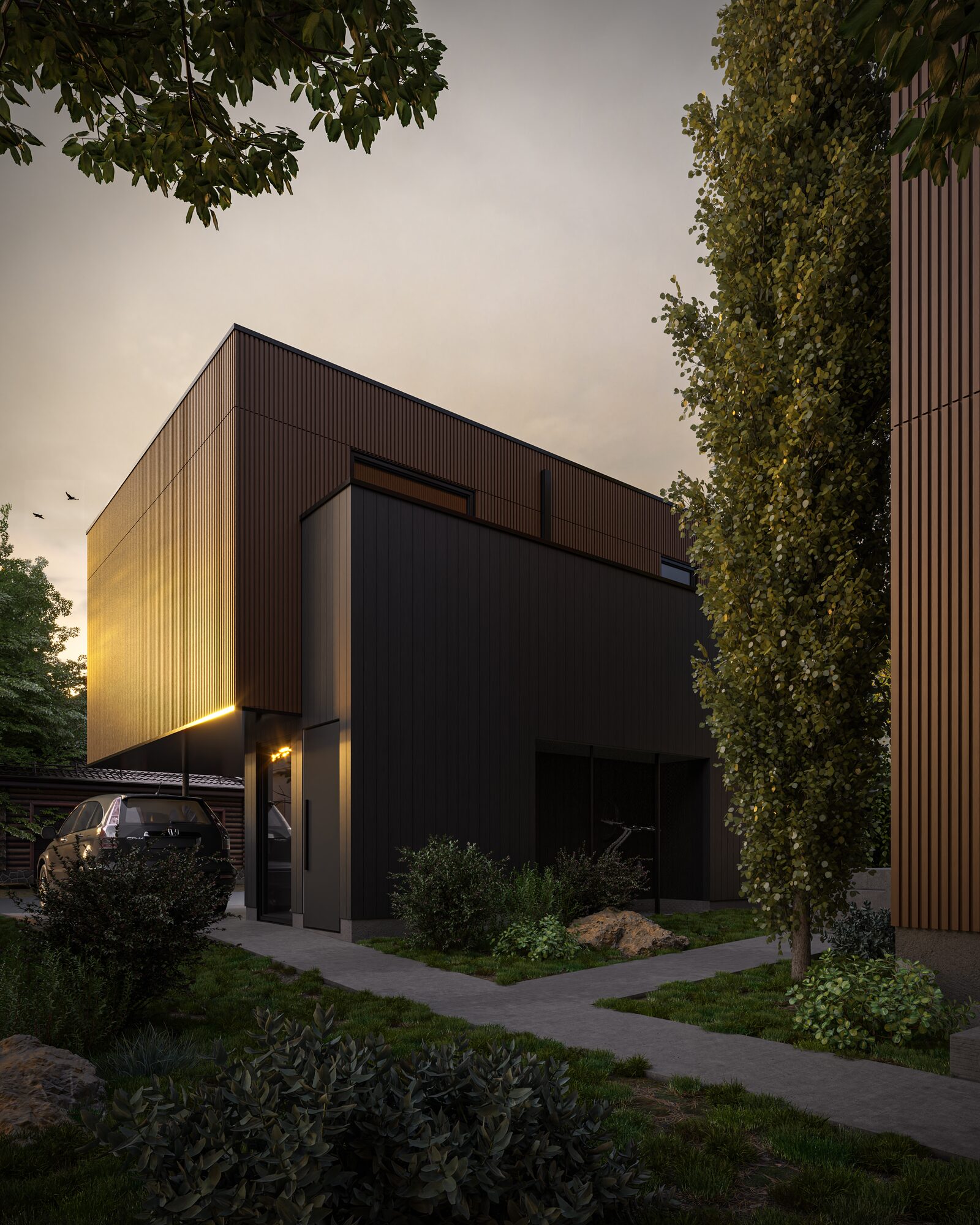 Ramsay Quintet missing middle housing in Calgary, with a ribbed upper volume cantilevered over a dark base, entry and landscaped walkway